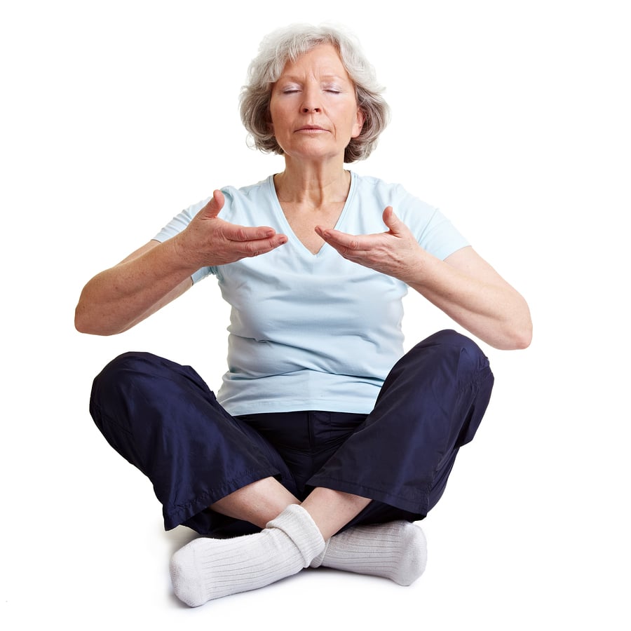 Caregivers in West Memorial TX: Old senior woman meditating and relaxing with breathing exercises